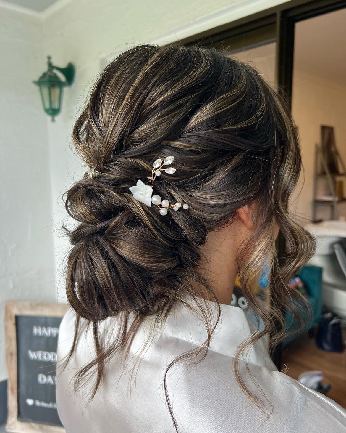 low textured bridal hair bun, dark hair with highlights